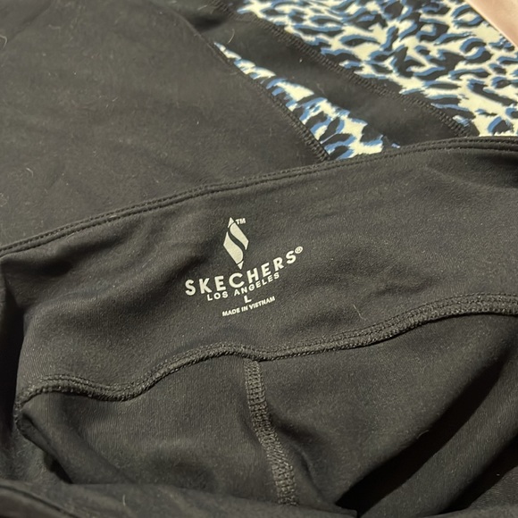 Sketcher leggings with blue and black animal print that goes down the leg. - Picture 2 of 2